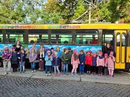 Children in front of a Tatra tram in Dresden